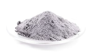 Close-up of aluminum oxide blasting media used in abrasive cleaning, ideal for metal restoration projects searched under “sandblasting near me.”
