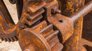 Close-up of rusted gears with visible wear. Does sandblasting remove rust effectively?