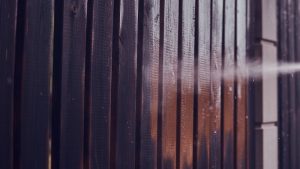 Wood fence being cleaned and restored by sandblasting in my area.