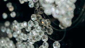 Close-up image of shiny glass beads with reflective surfaces, showcasing their sparkling texture.