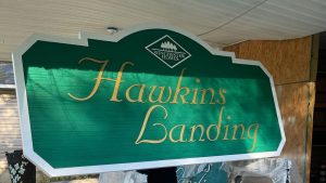 Finished sandblasted HDU sign with carved lettering and painted surface