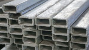 A stack of galvanized steel rectangular tubes.