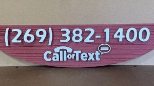 Sandblasted HDU sign with dimensional lettering and painted contact information